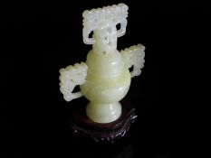 Chinese 20th Century White Jade Vase, the censer shaped vase featuring a plain body and circular