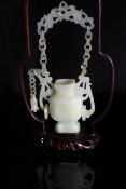 Chinese Qing Dynasty White Jade Suspended Vase, The square shaped vase having ornately carved