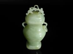 Chinese Qing Dynasty Celadon Jade Vase and Cover, the vase of simple baluster form having twin