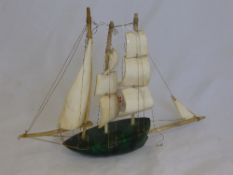 Malachite and Bone Sailing Boat, depicted in full sail. 13 x 21 cms.