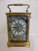 A continental carriage clock circa 1890 having four panels hand painted with butterflies and gilded