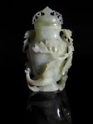 Chinese Pale Celadon Jade Vase, the vase of baluster form with white inclusion and dark speckling to