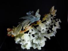 Chinese Celadon, Amber and Blue Jade Carving of a Phoenix, the splendid carving in high relief