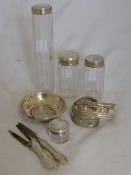 Four SilverTopped Cut Glass perfume bottles, together with a silver handled manicure set  two