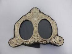 A London rococo style double silver photograph frame