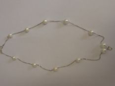 A 925 sterling silver white cultured real pearl tin cup necklace.