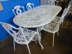 Large pierced cast iron oval garden table with six chairs. 186 x 92 x 73 cms