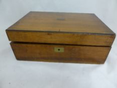 A Victorian light mahogany writing box having a small inscribed brass plaque to the top, approx. 30