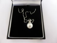 A 925 sterling silver large round white cultured real pearl pendant and chain (boxed)