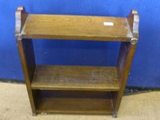 A small Edwardian wall mounted book shelf having carved decoration to the sides, approx. 48 x 16 x