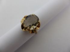 A lady`s 9 ct. gold smoky topaz dress ring, approx. 7 gms.