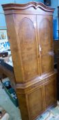 A walnut effect cocktail corner cabinet having a fitted interior, approx. 90 x 50 x 190 cms.