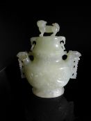 Chinese Pale Celadon Jade Vase, the bulbous shaped vase with white and dark green inclusions