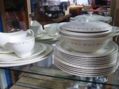 A part Wedgwood Ninette dinner service comprising three oval serving dishes, gravy boat, two lidded