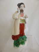 Porcelain Figure of a Russian, the figure dressed in traditional costume, marked K to base with