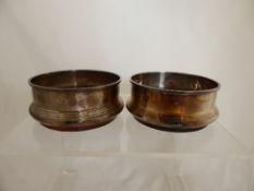 Two Solid Silver Birmingham Hallmark wine coasters with turned wood base.