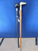 Cherry Wood Walking Stick, with a brass top depicting a setter together with another walking stick