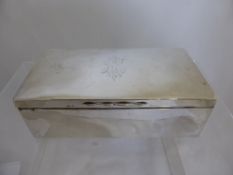 A silver cigarette box, Birmingham 19718, approx. 17 x 9 x 5 cms.