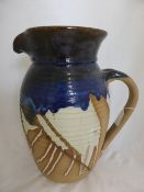 Large Studio Pottery Jug, the decorative jug of blue, brown and grey colouring. 37 x 20 cms, signed