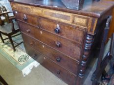 A large antique oak chest of drawers having two short and three long drawers, the chest having