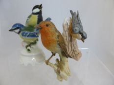 Two Goebel Bird Figures, dated 1967 The Nuthatch nr CV84, 14 cms and  a 1968 Robin nr CV100 12 cms