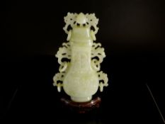 Chinese Pale Celadon Jade Vase and Cover, the flattened pear shaped vase decorated in shallow relief