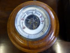 A vintage range finder together with a small round oak cased barometer and pipettes and a