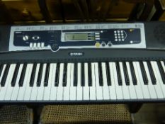 An electronic Yamaha keyboard, model No. YPT 210.