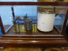 James Lucking & Co. Birmingham cylindrical barograph, mounted on a stepped mahogany base with chart