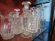 Eight cut glass decanters, some being antique together with a jug ( w a f )