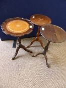 Three Wine Tables, all on turned columns with splayed feet, one having a leather insert to top.