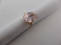 A lady`s 18 ct. gold 750 hallmarked two stone ring set with light pink oval cut possibly topaz,