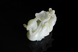 Chinese Celadon Jade Carving of a Seated Bird, The crested bird featuring carved feet and wings