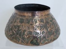 Indian Copper Hammered Bowl, the bowl with raised floral decoration and depicting bush buck