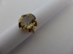 A lady`s 9 ct. gold topaz style ring, approx. 2.7 gms.