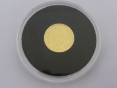 A 9 ct. gold  Triston da Cunha proof like 1 gm. Jubilee mint coin.