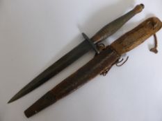 A World War II British Commando Fighting Knife with leather sheath. Overall length of knife 30 cms