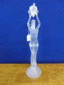 Opaque Glass Figure of a naked lady holding fruit above her head. approx 50 cms h