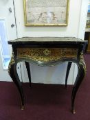 A Late 19th Century Gilt Metal and Boulle Desk, the serpentine top on brass hinges open to reveal