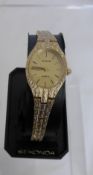 A Lady`s Cased Sekonda Wrist Watch, the cocktail watch with bark effect and gilt case and strap.