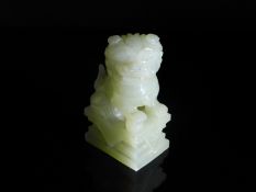 Chinese 20th Century Pale Celadon Jade Foo Dog, the figure featuring an ornately carved mane and