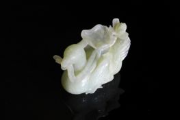 Chinese Qing Dynasty Celadon Jade Carving of a Seated Bird, The crested bird features carved feet
