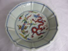 Chinese hand painted shaped Xuande dish depicting dragons , the dish having marks to the base,