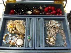 A Misc. Collection of Costume Jewellery incl. brooches, glass beads, sterling silver chains in a
