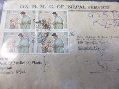 A box of all world philatelic covers, loose and in albums - commemorative and postally used incl.