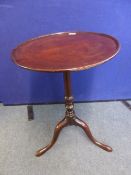 A Georgian Mahogany Wine Table on tripod base with turned centre column and three splayed feet,