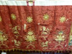 A Silk Red Damask Altar Frontal, circa 1870, hand embroidered with gold thread depicting fleurs de