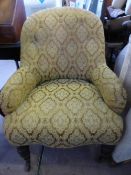 An Antique Button Back Bedroom / Nursing Chair having turned front legs and casters and covered in a