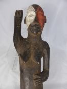 Antique West African Welcoming Post, depicting a female form, the figure having right arm raised