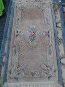 Three Washed Chinese Carpets of various colours, 123 x 60 cms, 169 x 92 cms and 140 x 69 cms.